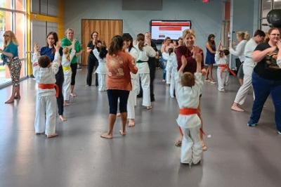 Mothers are invited to join the class and exercise with their student children